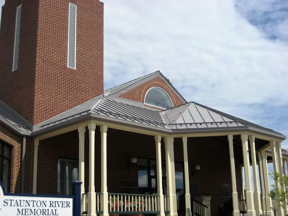Skilled roofing craftsmen working on a residential roof in Huntington Bay